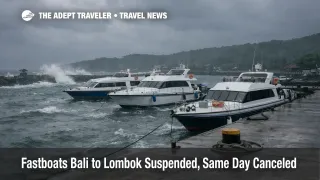 Bali Lombok fastboats suspended as rough seas pound Padang Bai pier, with stranded boats under dark monsoon clouds