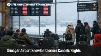 Srinagar airport snowfall closure scene with cancellations on boards and travelers waiting as snow falls outside the terminal