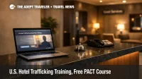 U.S. hotel trafficking training shown on a laptop at an empty Washington, D.C. hotel front desk