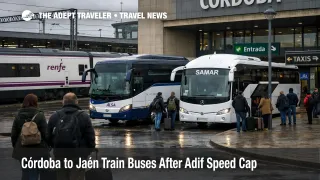 Córdoba to Jaén rail bus swaps, travelers queue for substitute coaches outside Córdoba station under overcast skies.