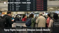 Tigray flights suspended, travelers at Addis Ababa Bole scan a departures board showing canceled Ethiopian Airlines flights to Mekelle