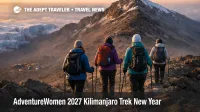 AdventureWomen Kilimanjaro trek 2027 hikers at dawn near Uhuru Peak, showing the high altitude challenge