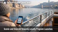 Scenic and Emerald Rewards loyalty program shown as a river cruiser checks booking details while sailing the Danube