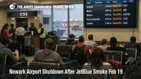 Newark airport shutdown scene shows delayed departures board at EWR after JetBlue Flight 543 smoke evacuation