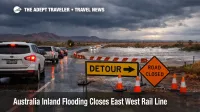 Australia inland flooding travel disruption near Port Augusta, wet highway detour and slow traffic under storm clouds