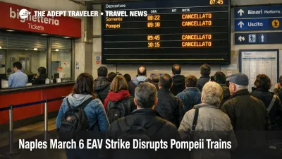 Passengers wait under boards at Napoli Porta Nolana during a Naples March 6 EAV strike disrupting Pompeii trains