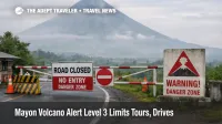 Mayon Volcano Alert Level 3 road barrier near Legazpi, showing restricted access and haze that can disrupt tours