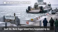 Sugar Island ferry suspension in Sault Ste. Marie, with thick ice packed at the dock blocking the crossing