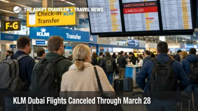 KLM Dubai cancellations shown by travelers watching departure boards at Amsterdam Airport Schiphol after service cuts
