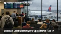 Delta East Coast weather waiver shown by crowded ATL gate area, delay screens, and wet ramp before March 16 storms