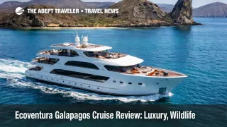 Small luxury yacht on an Ecoventura Galapagos cruise sailing past volcanic islands in Ecuador's Galapagos archipelago