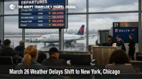 March 26 weather delays slow New York flights as travelers wait beneath delay screens inside LaGuardia Airport