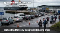 CalMac ferry disruption Scotland shown at Troon ferry terminal with queued vehicles and passengers awaiting island service
