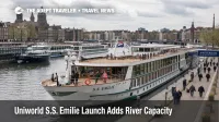 A modern river cruise ship in Amsterdam shows European river cruise expansion and growing dock crowding pressure.