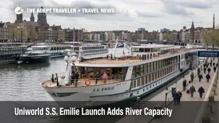 A modern river cruise ship in Amsterdam shows European river cruise expansion and growing dock crowding pressure.