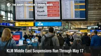 KLM Middle East suspensions shown on Schiphol departure boards as travelers wait for disrupted flights to Tel Aviv and Dubai