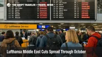 Lufthansa Middle East suspensions shown on Frankfurt Airport boards as travelers queue to rebook Gulf and Levant trips.