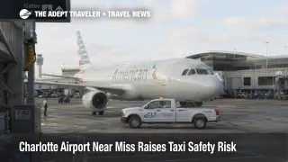 Charlotte airport near miss scene at CLT shows an American jet paused near a ground vehicle in the gate area