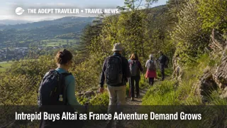 France adventure travel demand shown through a guided hiking tour near Lyon, France, in a realistic small group setting