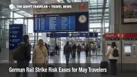 Travelers check boards at Frankfurt Airport station as German rail strike risk eases before May trips.