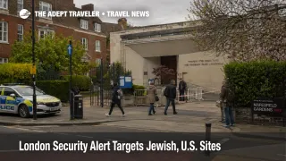 Travelers near a London synagogue entrance illustrate the London security alert and site caution guidance.