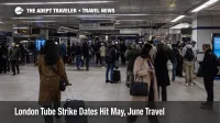 London Tube strike dates show travelers crowding a central Underground station with luggage during service disruption.